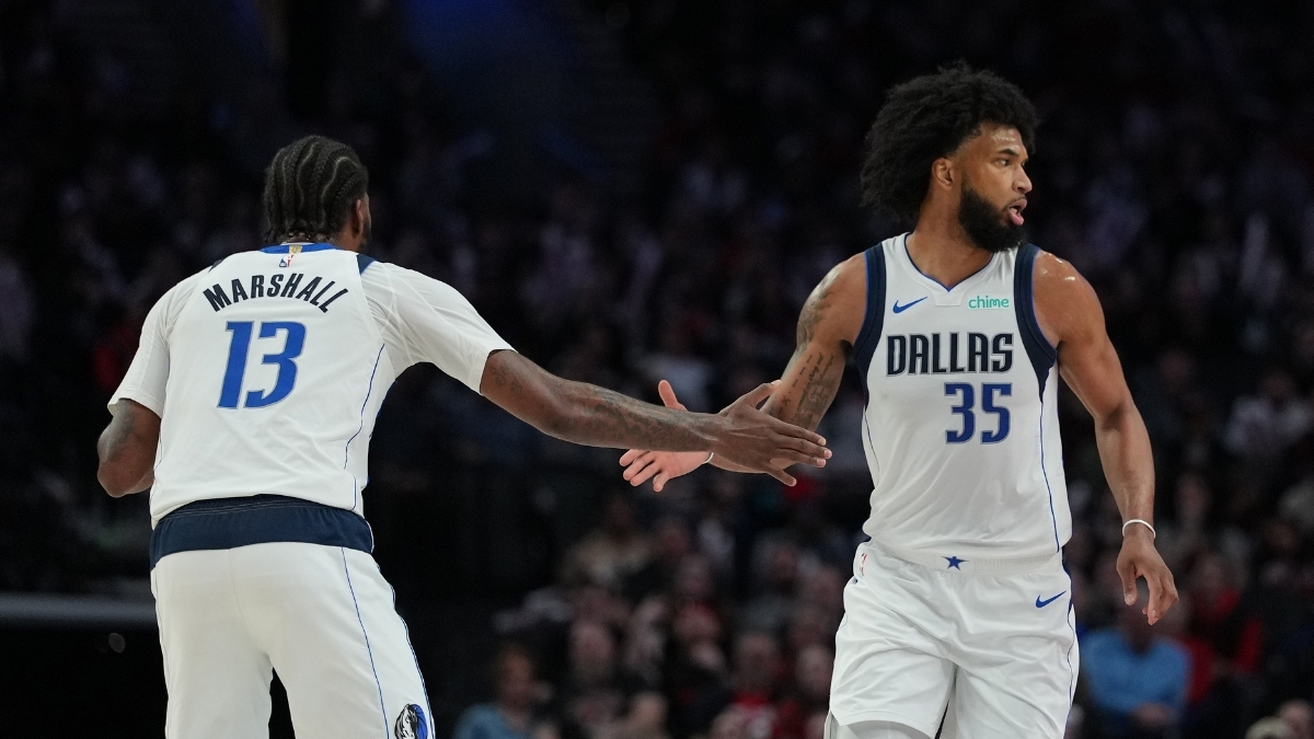 Marvin Bagley III (#35) and Naji Marshall (#13) of the Dallas Mavericks celebrate during a road game against the Portland Trail Blazers at Moda Center on March 27, 2026.