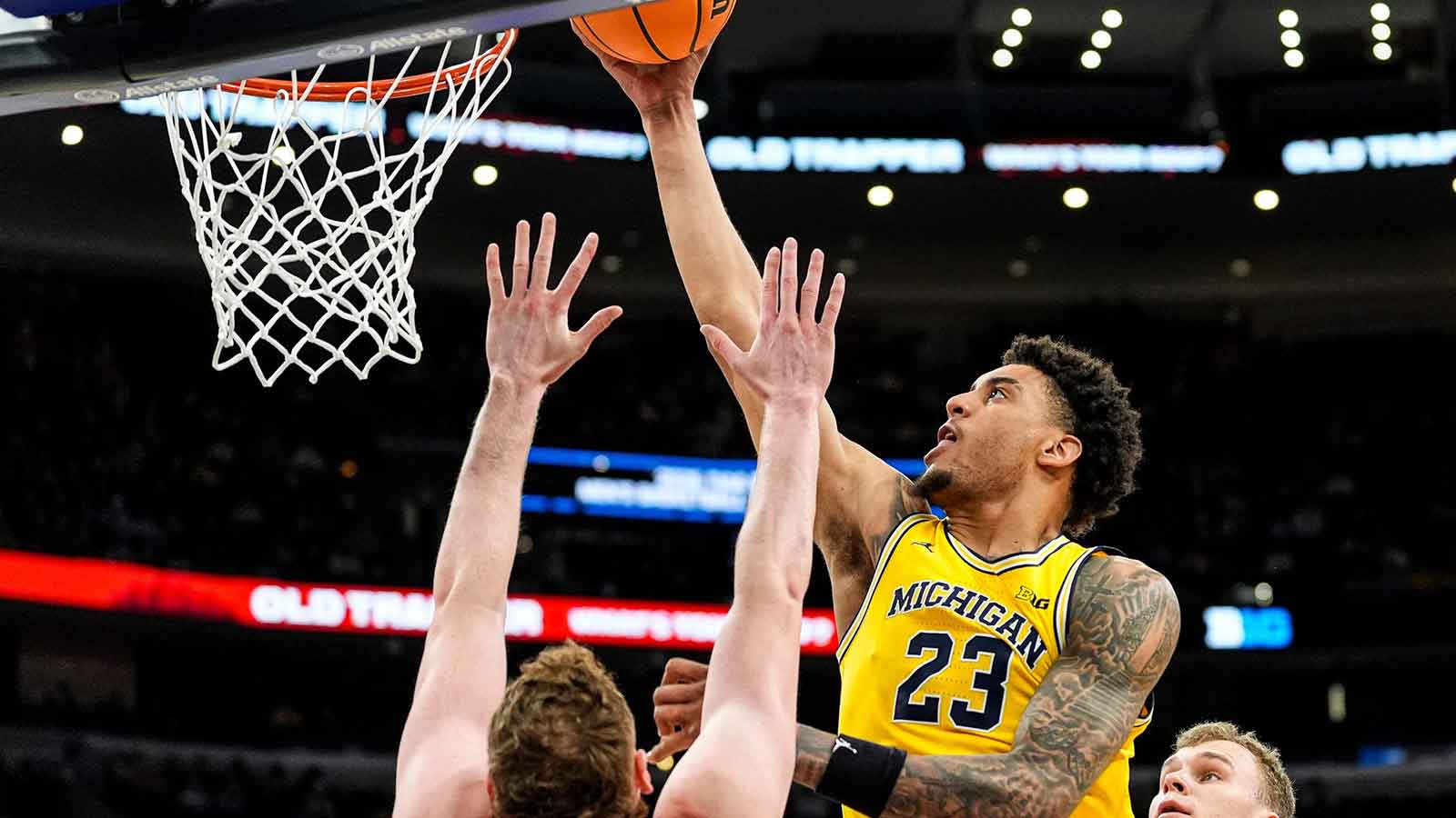 Michigan forward Yaxel Lendeborg (23) goes to the basket against Wisconsin forward Austin Rapp (22) during the second half of Big Ten Tournament semifinal at United Center in Chicago