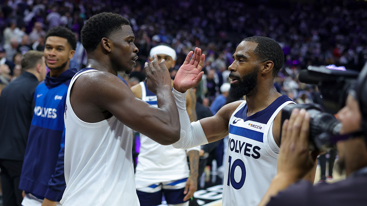 Oct 24, 2024; Sacramento, California, USA; Minnesota Timberwolves guard Anthony Edwards (5) and guard Mike Conley (10) celebrate after the game against the Sacramento Kings at Golden 1 Center.