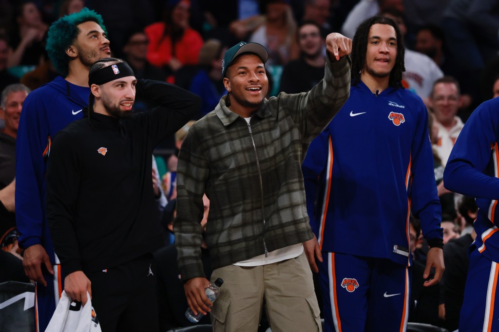 A smiling Miles McBride (center), who underwent a sports hernia surgery and has been out since late January, reacts from the bench during the Knicks' 136-110 blowout win over the Pacers on March 17, 2026 at the Garden.