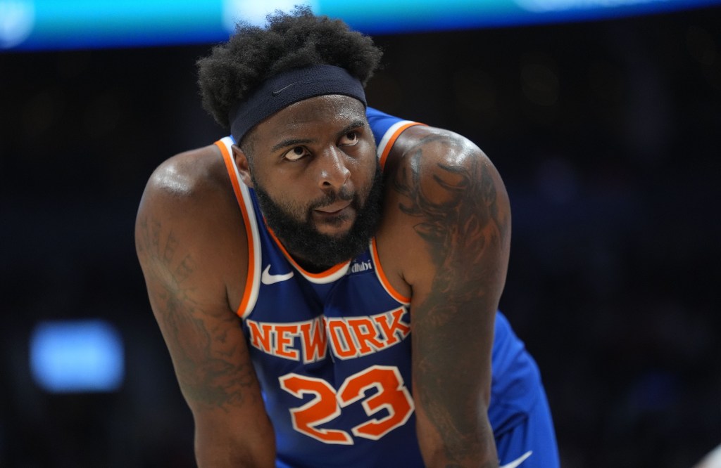 Mitchell Robinson looks on during a break in the action during the Knicks' blowout win over the Raptors.