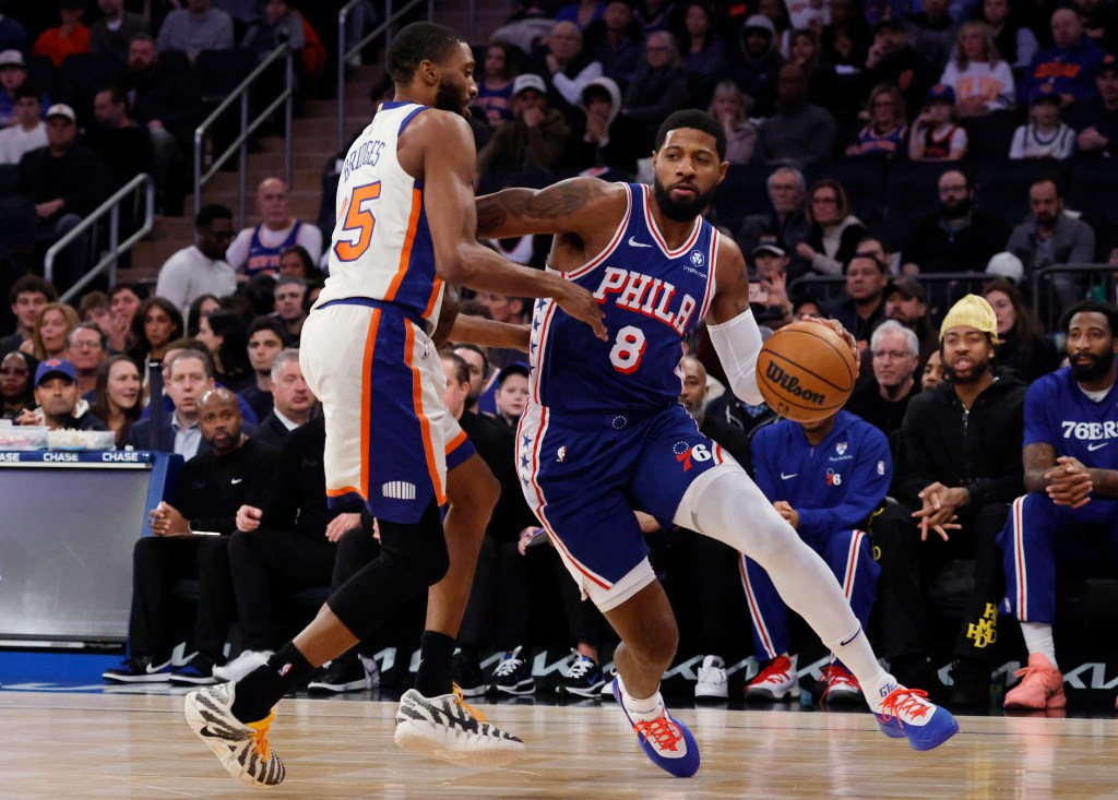 New York Knicks guard Mikal Bridges defends against Philadelphia 76ers forward Paul George in the first half at Madison Square Garden in Manhattan, New York, Saturday, January 3, 2026. 