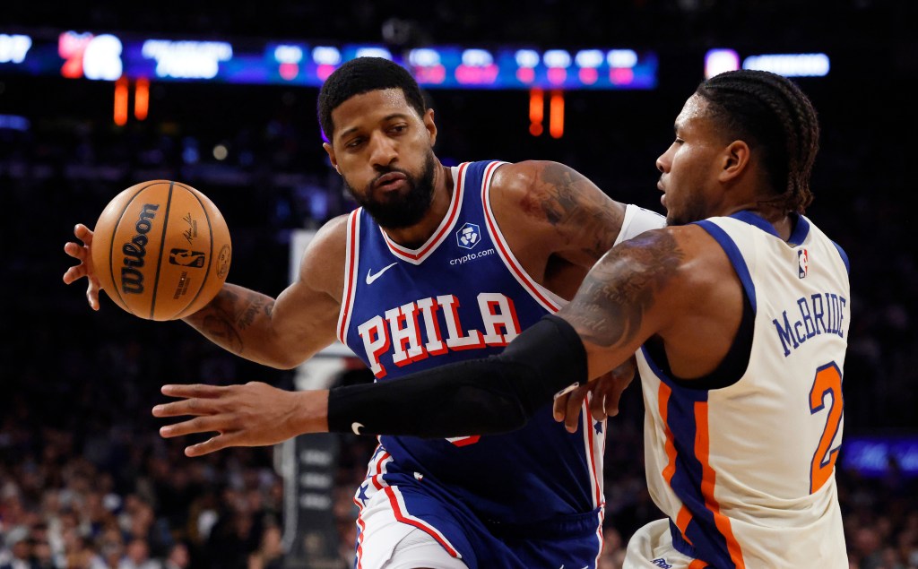 Philadelphia 76ers forward Paul George drives two the basket as New York Knicks guard Miles McBride defends in the first half at Madison Square Garden in Manhattan, New York, Saturday, January 03, 2026.