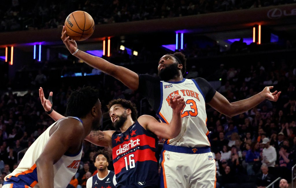 03/22/26 New York Knicks vs Washington Wizards at Madison Square Garden: Center Mitchell Robinson #23 of the New York Knicks pulls a rebound away from forward Anthony Gill #16 of the Washington Wizards 