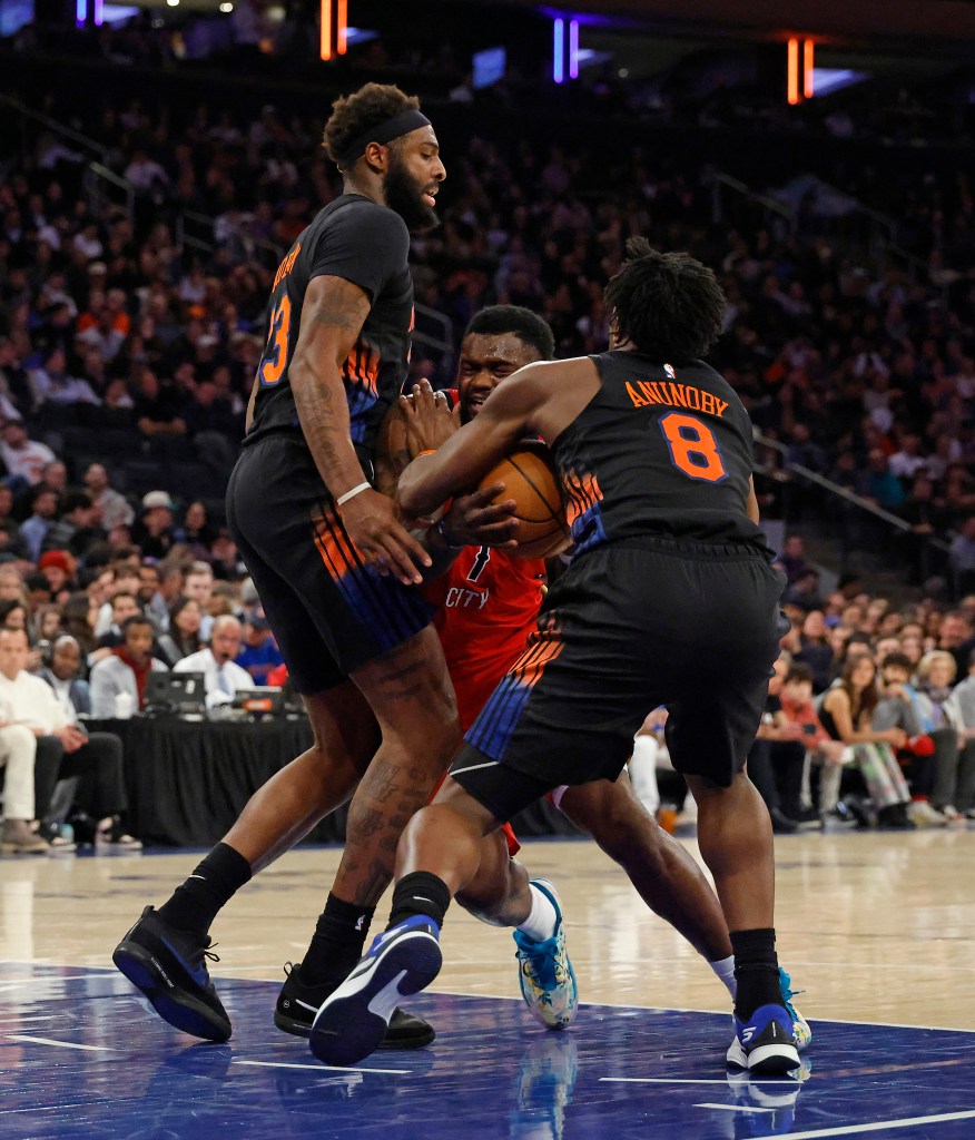 New York Knicks center Mitchell Robinson and New York Knicks forward OG Anunoby double team New Orleans Pelicans forward Zion Williamson during the second quarter