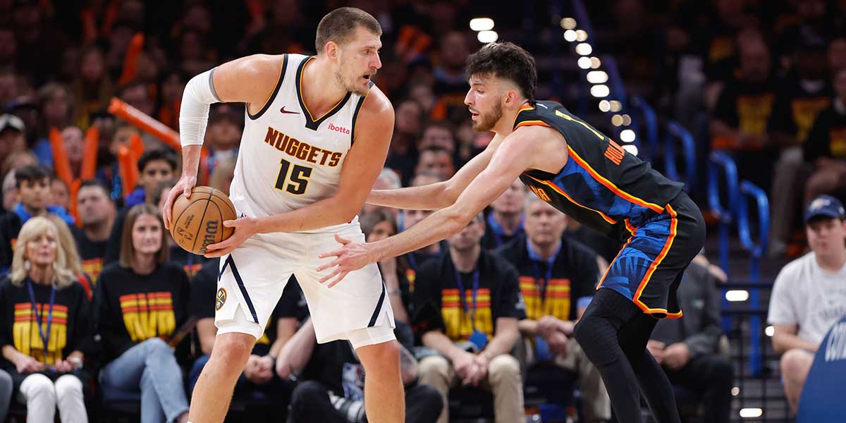 Denver Nuggets center Nikola Jokic (15) drives against Oklahoma City Thunder forward Chet Holmgren (7) during the second half during game one of the second round for the 2025 NBA Playoffs at Paycom Center.