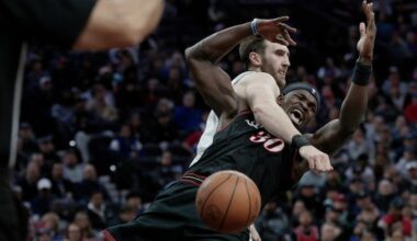 Sixers # 30 Adem Bona falls to the floor after being fouled by Spurs # 7 Luke Kornet in the first half of the San Antonio Spurs vs. Philadelphia 76ers (Sixers) NBA game at Xfinity Mobile Arena in Philadelphia on Tuesday, March 3, 2026.