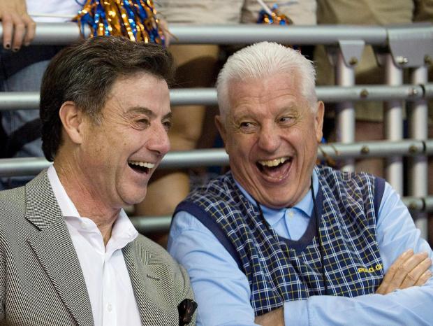 Bill Donovan Sr., right, has a laugh with Louisville coach Rick Pitino during Florida's 69-49 victory over Georgia Southern on Nov. 18, 2009, in Gainesville, Fla. (AP Photo/Phil Sandlin)