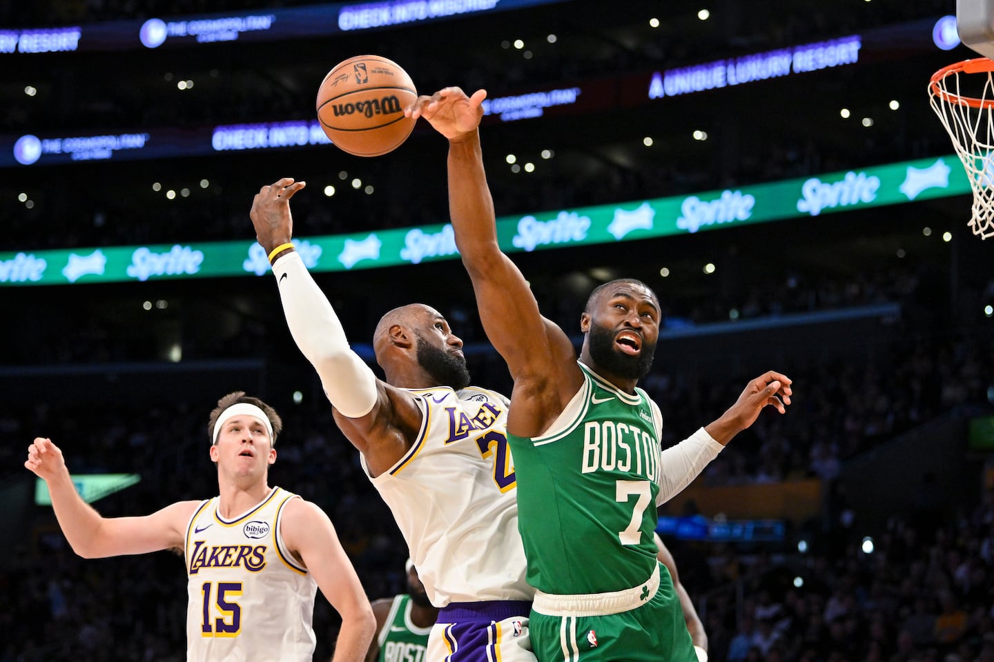 Jaylen Brown (right) and LeBron James (center) battle for a rebound in Boston's 111-89 win over the Lakers on Feb. 22.