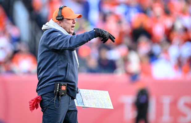 Head coach Sean Payton of the Denver Broncos works during the second quarter against the Buffalo Bills at Empower Field at Mile High in Denver, Colorado on Saturday, Jan. 17, 2026. (Photo by AAron Ontiveroz/The Denver Post)