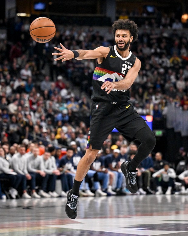 Jamal Murray (27) of the Denver Nuggets passes during the first quarter against the Memphis Grizzlies at Ball Arena in Denver, Colorado on Wednesday, February 11, 2026. (Photo by AAron Ontiveroz/The Denver Post)