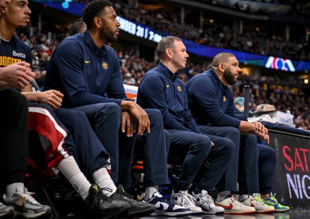 Head coach David Adelman of the Denver Nuggets sits on the bench with assistant coaches Mike Moser and Jared Dudley during the third quarter against the Houston Rockets at Ball Arena in Denver, Colorado on Monday, December 15, 2025. (Photo by AAron Ontiveroz/The Denver Post)