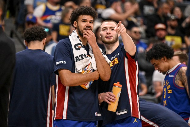 Cameron Johnson (23) and Christian Braun (0) of the Denver Nuggets look into the stands during the fourth quarter against the Houston Rockets at Ball Arena in Denver on Wednesday, March 11, 2026. (Photo by AAron Ontiveroz/The Denver Post)