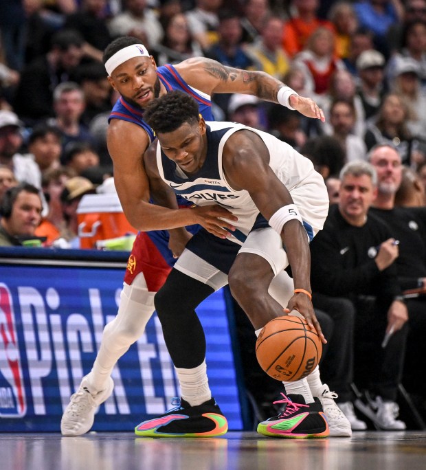 Bruce Brown (11) defends Anthony Edwards (5) of the Minnesota Timberwolves during the third quarter at Ball Arena in Denver on Sunday, March 1, 2026. (Photo by AAron Ontiveroz/The Denver Post)