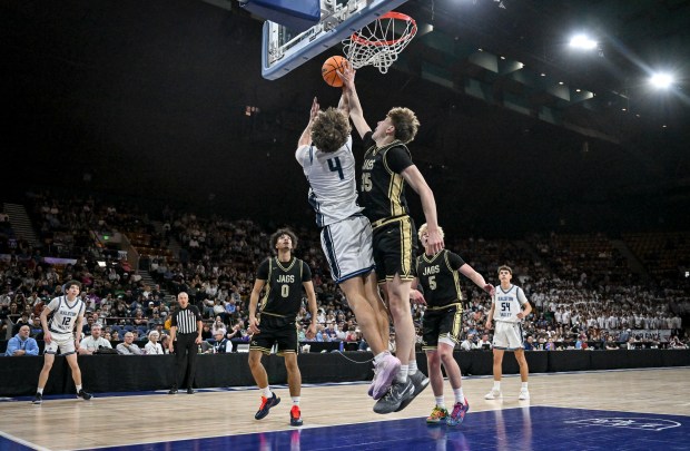 Kai Valentine (35) of the Rock Canyon Jaguars blocks Zeke Andrews (4) of the Ralston Valley Mustangs during the first half of the 6A state championship basketball game at the Denver Coliseum in Denver on Saturday, March 14, 2026. (Photo by AAron Ontiveroz/The Denver Post)