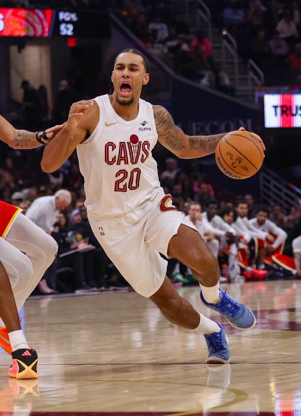 The Cavaliers' Jaylon Tyson drives against the Hawks on Nov. 2. (Tim Phillis - For The News-Herald)