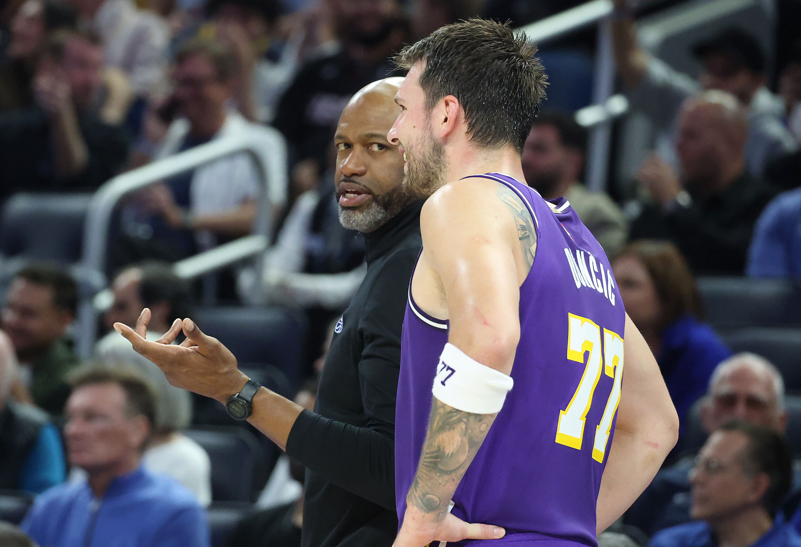 Orlando head coach Jamahl Mosley chats with LA guard Luke...