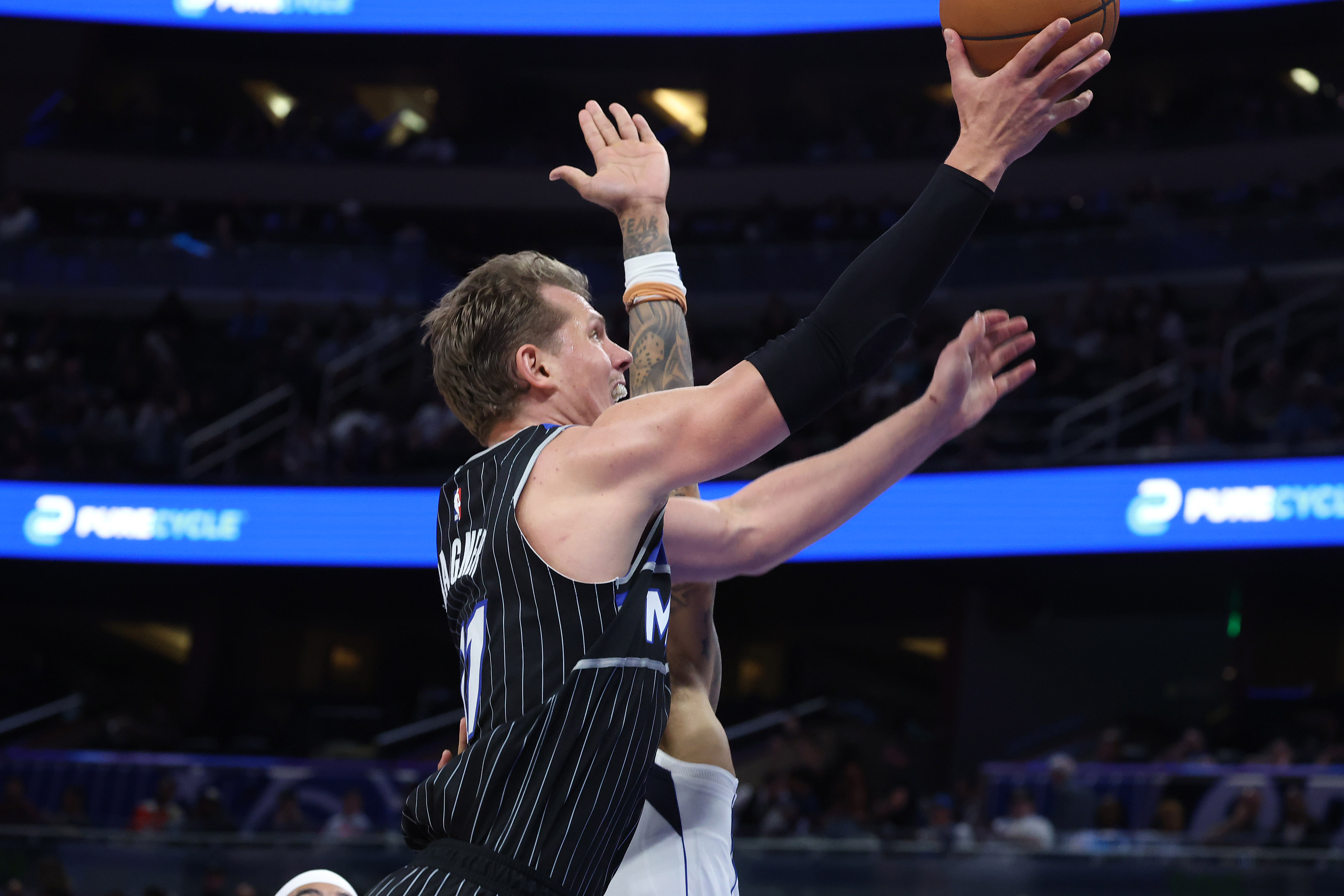 Orlando center Mo Wagner scores during the Dallas Mavericks at...