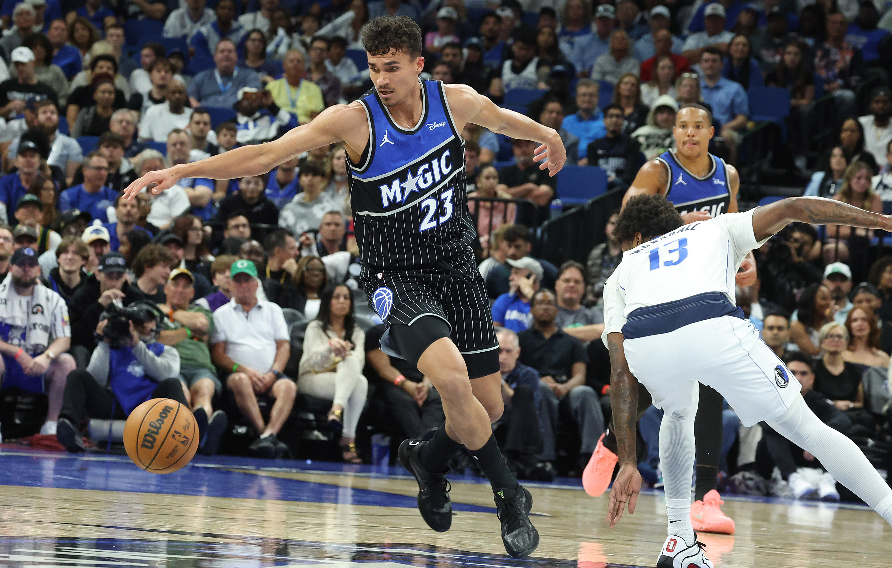 Orlando forward Tristan da Silva (23) reaches for a loose...