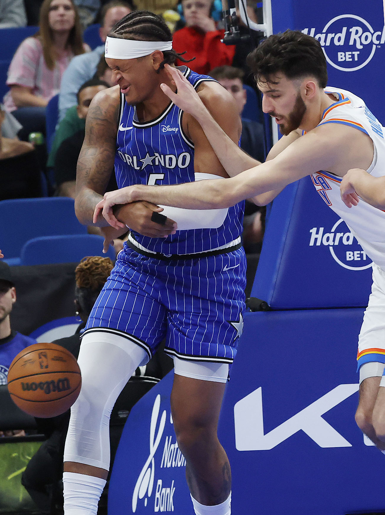 Orlando forward Paolo Banchero (left) is fouled by OKC forward...