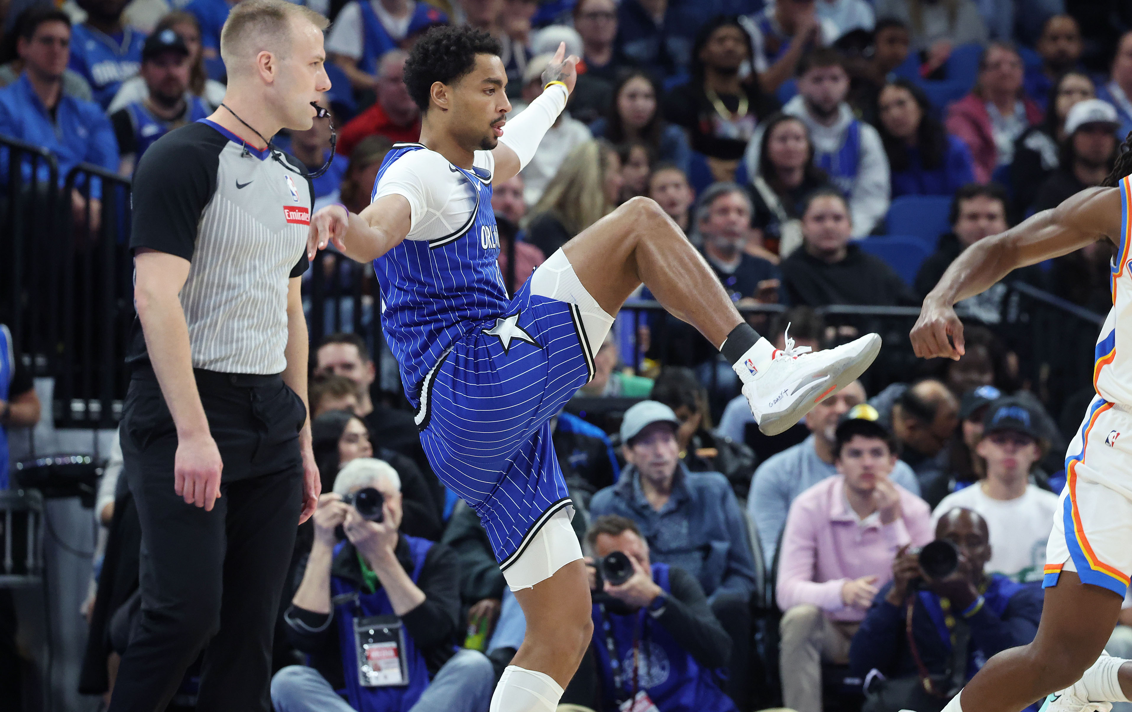 Magic guard Jett Howard tries to stay balanced during the...