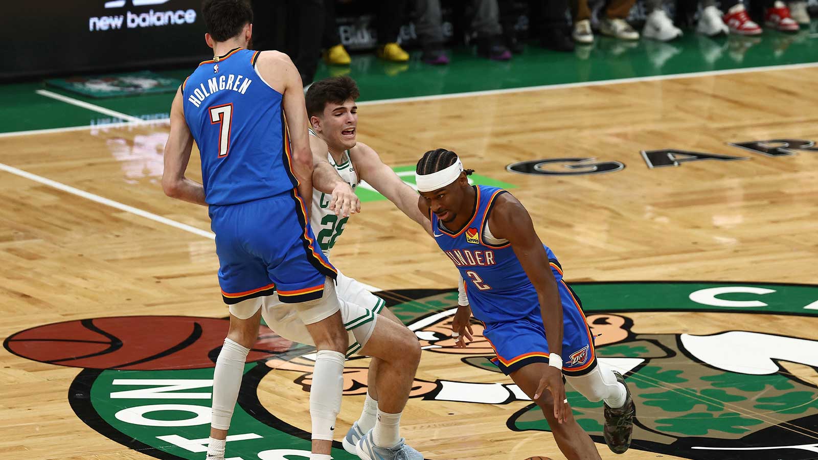 Thunder center Chet Holmgren (7) sets a pick on Boston Celtics guard Hugo Gonzalez (28) for guard Shai Gilgeous-Alexander (2) to go around him during the first quarter at TD Garden