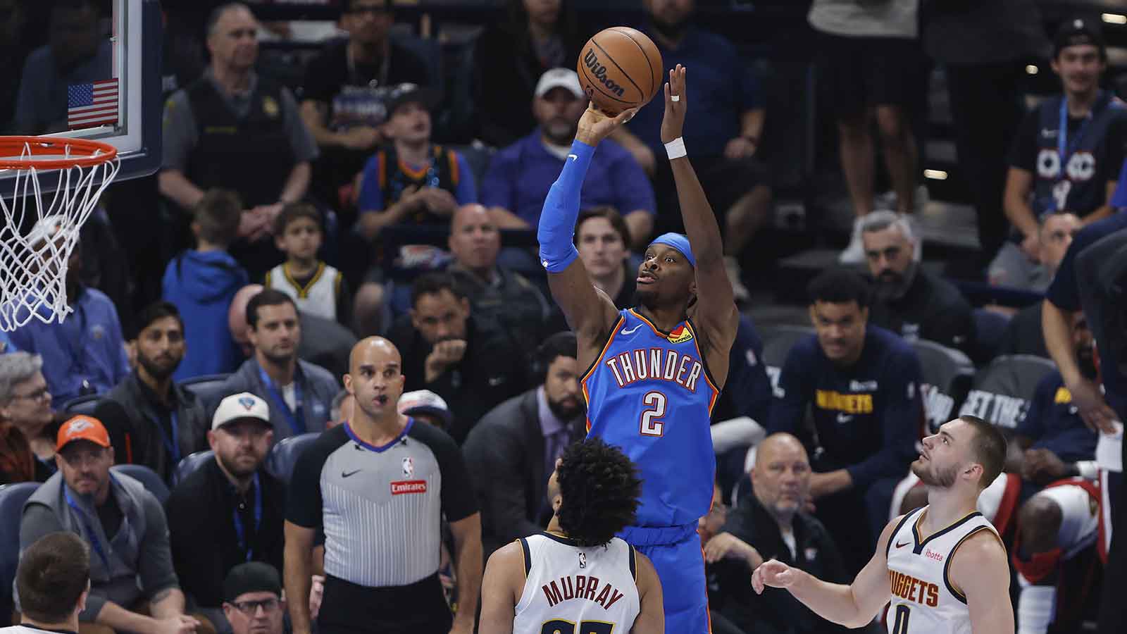 Thunder guard Shai Gilgeous-Alexander (2) shoots against the Denver Nuggets during the first quarter at Paycom Center