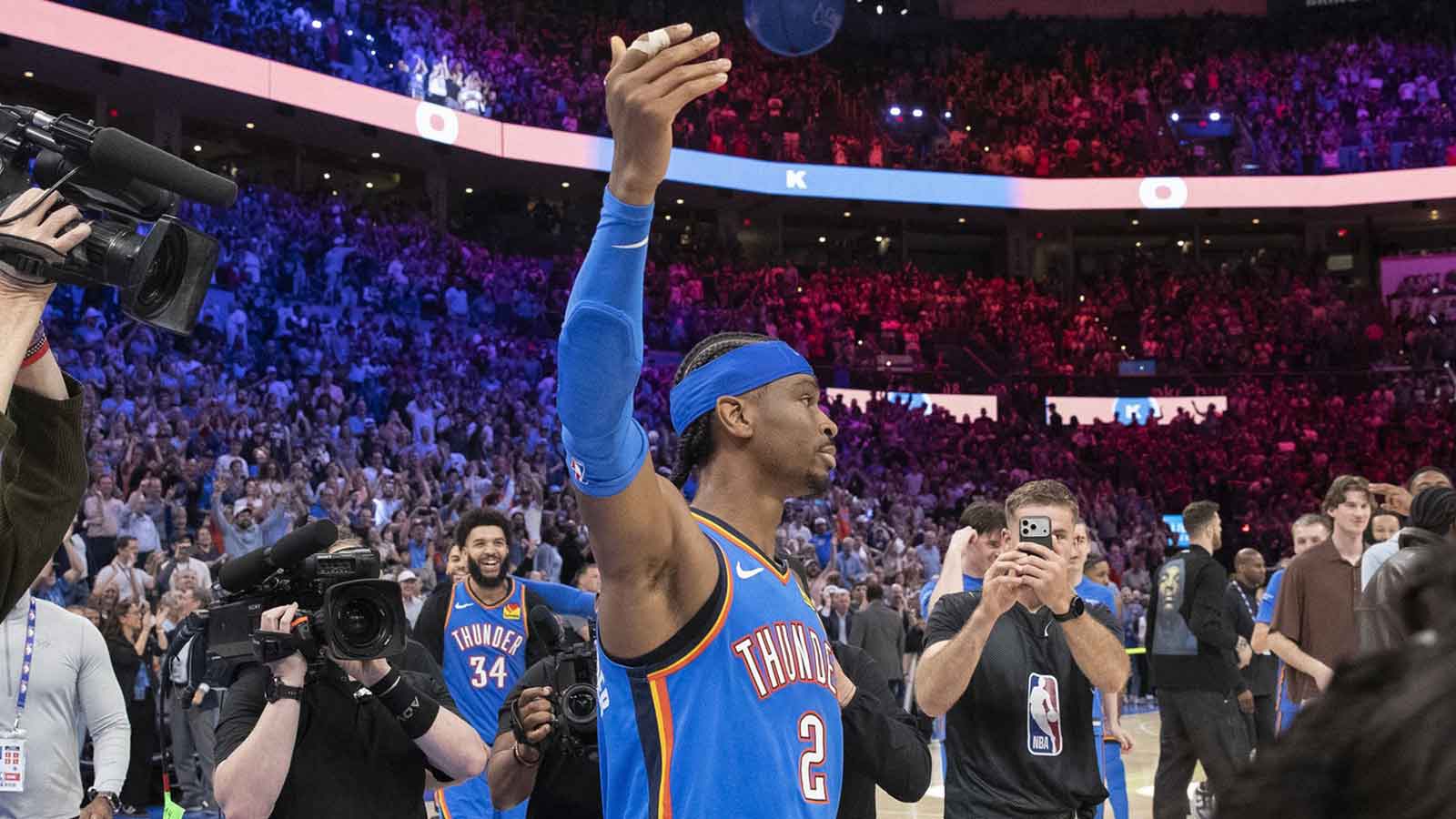 Thunder guard Shai Gilgeous-Alexander (2) gestures and walks around the court after sinking a game winner 3 pointer basket against the Denver Nuggets during the second half at Paycom Center