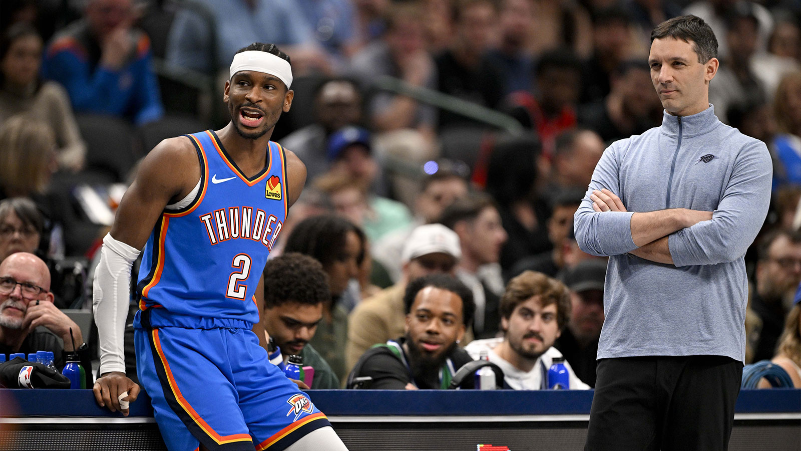 Thunder guard Shai Gilgeous-Alexander (2) and head coach Mark Daigneault look on during the second quarter against the Dallas Mavericks at the American Airlines Center