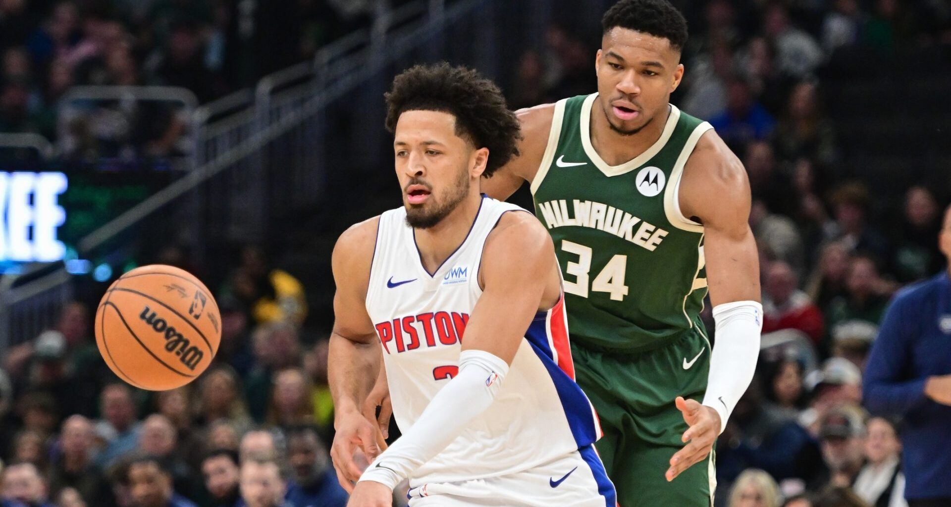 Dec 16, 2023; Milwaukee, Wisconsin, USA; Detroit Pistons guard Cade Cunningham (2) is guarded by Milwaukee Bucks forward Giannis Antetokounmpo (34) in the first quarter at Fiserv Forum. Mandatory Credit: Benny Sieu-USA TODAY Sports