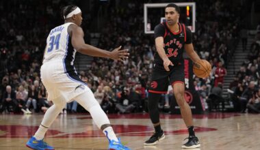 Mar 15, 2024; Toronto, Ontario, CAN; Toronto Raptors forward Jontay Porter (34) points to a spot as he controls the ball against Orlando Magic center Wendell Carter Jr. (34) during the second half at Scotiabank Arena.