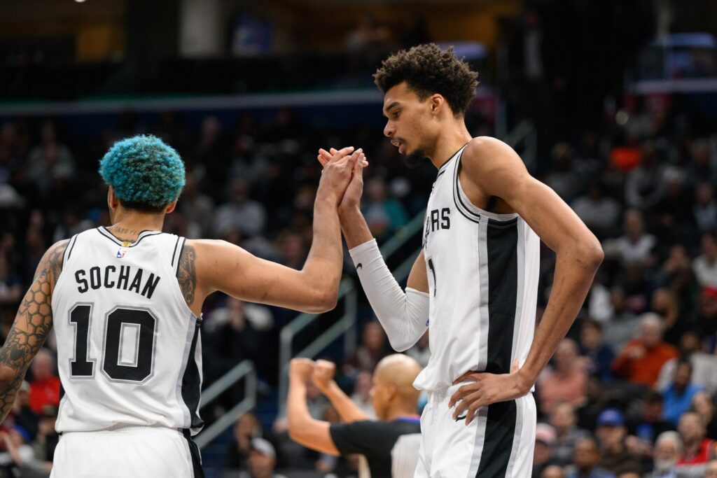 Feb 10, 2025; Washington, District of Columbia, USA; San Antonio Spurs center Victor Wembanyama (1) and San Antonio Spurs forward Jeremy Sochan (10) reacts during the fourth quarter against the Washington Wizards at Capital One Arena. Mandatory Credit: Reggie Hildred-Imagn Images