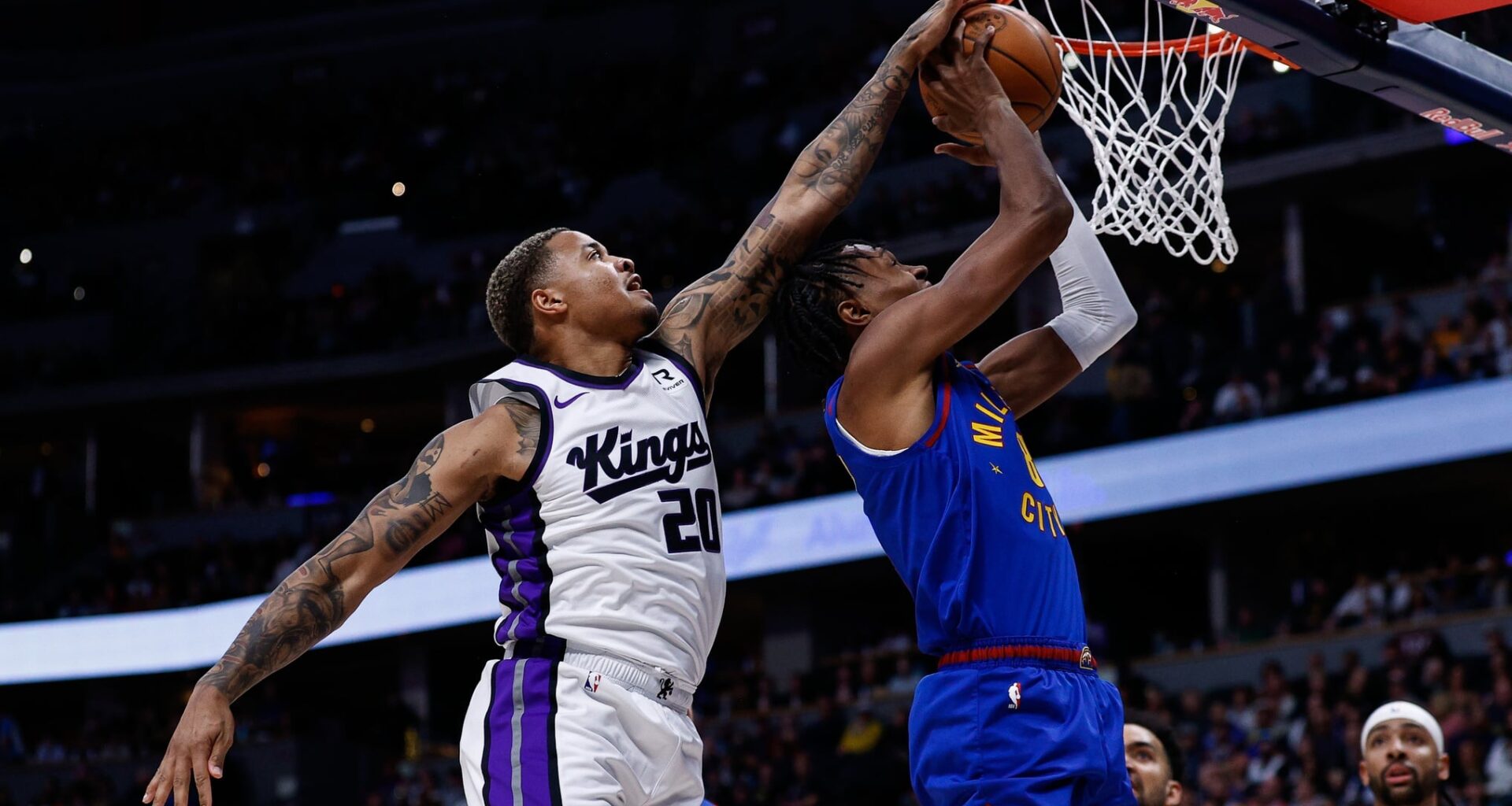 Mar 5, 2025; Denver, Colorado, USA; Sacramento Kings guard Markelle Fultz (20) blocks the shot attempt of Denver Nuggets forward Peyton Watson (8) in the first quarter at Ball Arena. Mandatory Credit: Isaiah J. Downing-Imagn Images