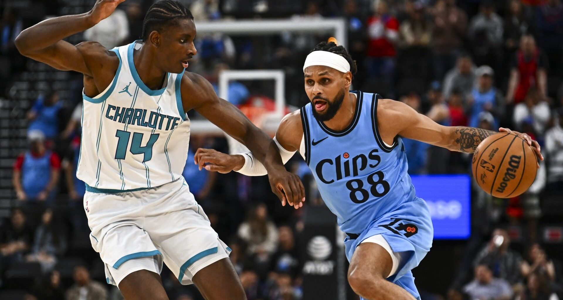 Mar 16, 2025; Inglewood, California, USA; LA Clippers guard Patty Mills (88) moves the ball against Charlotte Hornets forward Moussa Diabate (14) during the second half at Intuit Dome. Mandatory Credit: Jonathan Hui-Imagn Images