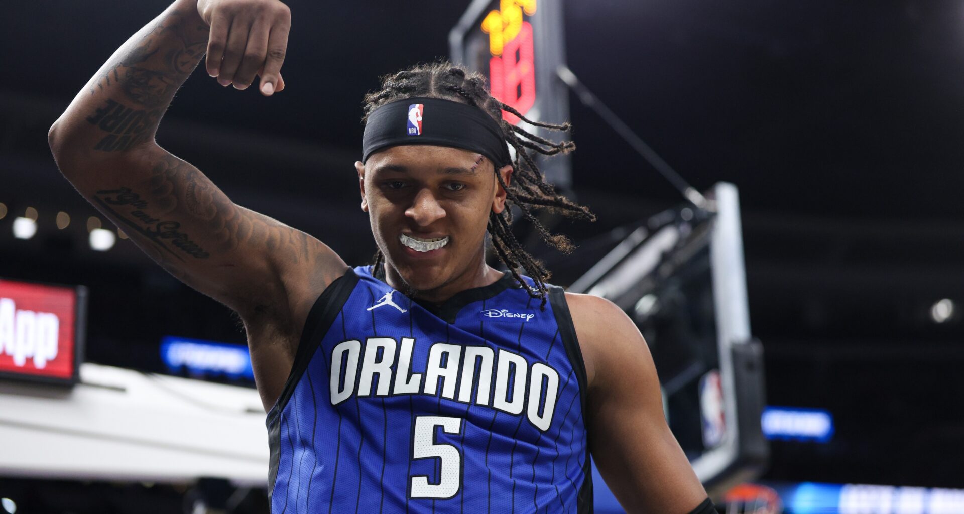 Apr 15, 2025; Orlando, Florida, USA; Orlando Magic forward Paolo Banchero (5) reacts after basket against the Atlanta Hawks in the fourth quarter at Kia Center. Mandatory Credit: Nathan Ray Seebeck-Imagn Images