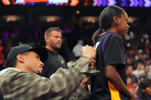 Sep 19, 2025; Phoenix, Arizona, USA; Phoenix Suns player Devin Booker signs autographs during the game between the Phoenix Mercury and the New York Liberty during the second half of game three of round one for the 2025 WNBA Playoffs at PHX Arena. Mandatory Credit: Joe Camporeale-Imagn Images