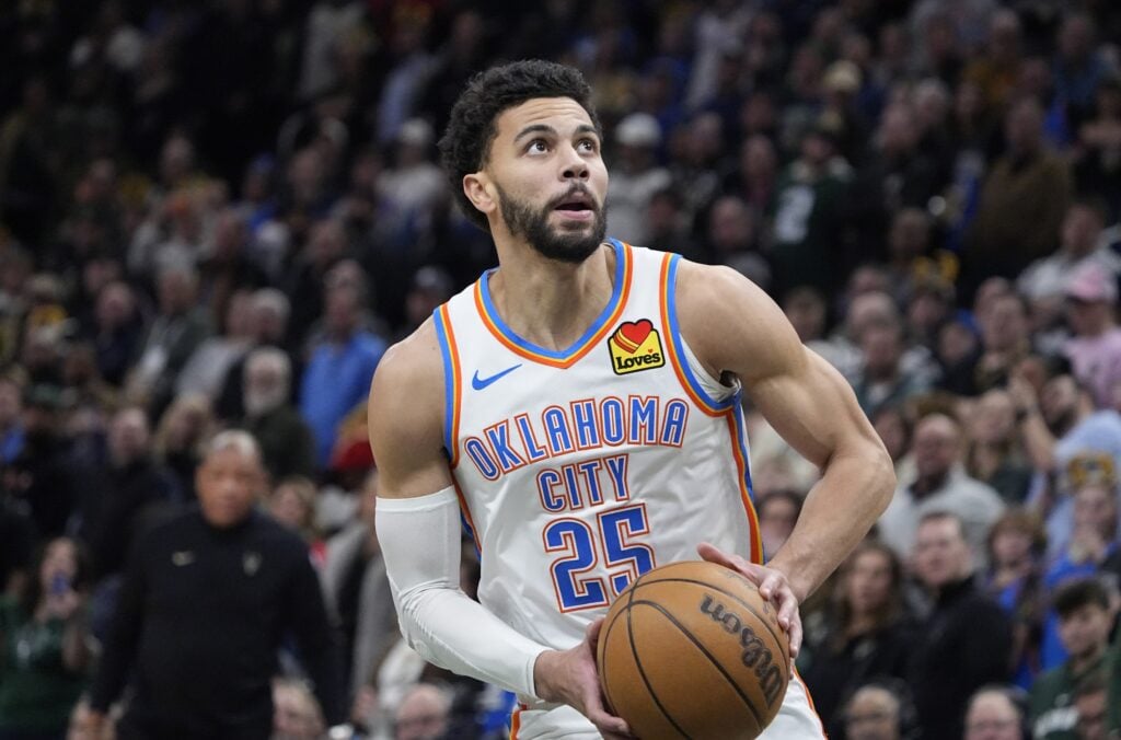 Jan 21, 2026; Milwaukee, Wisconsin, USA; Oklahoma City Thunder guard Ajay Mitchell (25) goest up for shot after stealing the ball from he Milwaukee Bucks at Fiserv Forum. Mandatory Credit: Michael McLoone-Imagn Images