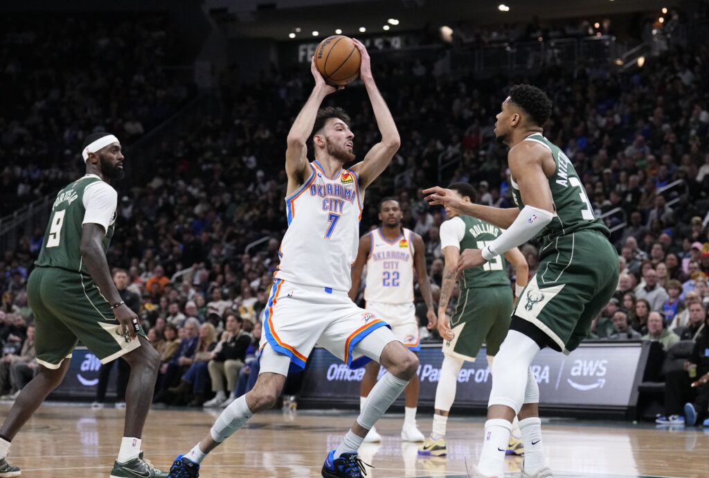 Jan 21, 2026; Milwaukee, Wisconsin, USA; Oklahoma City Thunder center/forward Chet Holmgren (7) drives to the basket against Milwaukee Bucks forward Giannis Antetokounmpo (34) in the first half at Fiserv Forum. Mandatory Credit: Michael McLoone-Imagn Images
