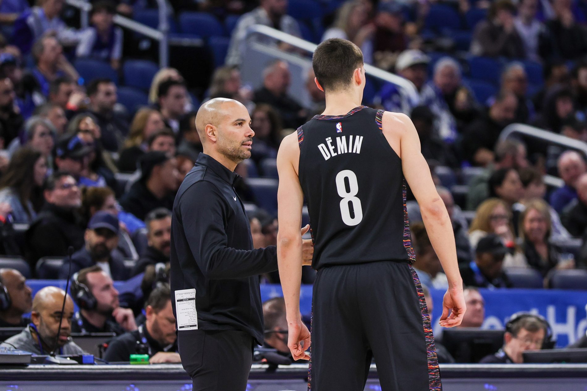 Brooklyn Nets head coach Jordi Fernandez talks to guard Egor Demin (8) during the first quarter against the Orlando Magic at Kia Center.