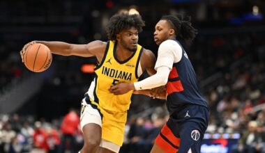 Feb 20, 2026; Washington, District of Columbia, USA; Indiana Pacers forward Jarace Walker (5) drives against Washington Wizards guard Bub Carrington (7) during the fourth quarter at Capital One Arena.