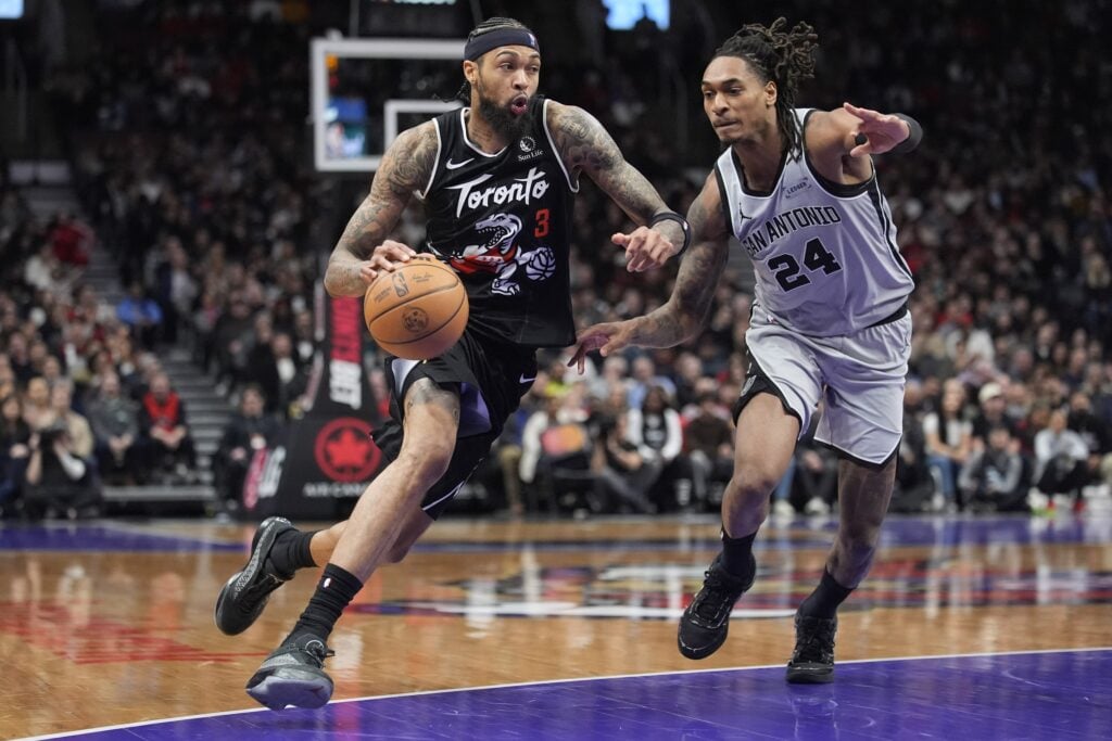 Toronto Raptors forward Brandon Ingram (3) drives to the basket against San Antonio Spurs guard Devin Vassell (24) during the second half at Scotiabank Arena.