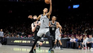 Feb 26, 2026; Brooklyn, New York, USA; San Antonio Spurs forward Victor Wembanyama (1) drives to the basket against Brooklyn Nets forward Danny Wolf (2) and center Nic Claxton (33) during the second quarter at Barclays Center. Mandatory Credit: Brad Penner-Imagn Images