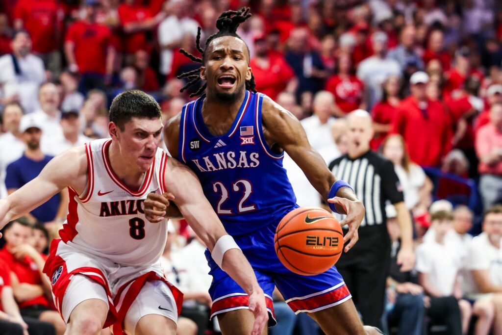 Arizona Wildcats forward Ivan Kharchenkov (8) fouls Kansas Jayhawks guard Darryn Peterson (22) during the first half of the game at McKale Memorial Center.