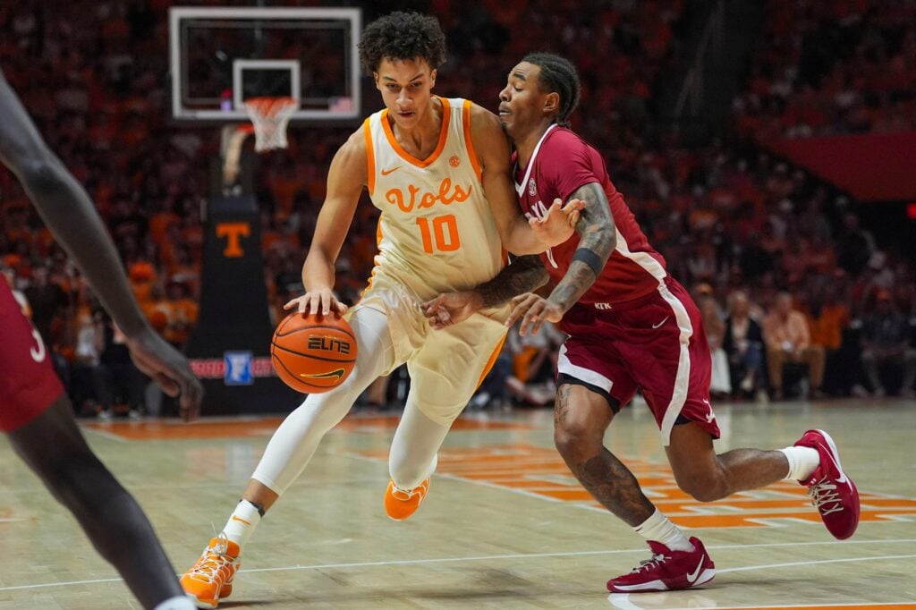 Tennessee forward Nate Ament (10) dribbles the ball past Alabama guard Labaron Philon Jr. (0) during a NCAA basketball game between Tennessee and Alabama at Thompson-Boling Arena at Food City Center in Knoxville, Tenn., on Feb. 28, 2026.