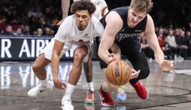 Mar 1, 2026; Brooklyn, New York, USA; Cleveland Cavaliers guard Craig Porter Jr. (9) and Brooklyn Nets forwrd Grant Nelson (16) fight for a loose ball in the third quarter at Barclays Center.