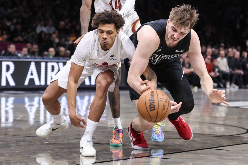 Mar 1, 2026; Brooklyn, New York, USA; Cleveland Cavaliers guard Craig Porter Jr. (9) and Brooklyn Nets forwrd Grant Nelson (16) fight for a loose ball in the third quarter at Barclays Center.