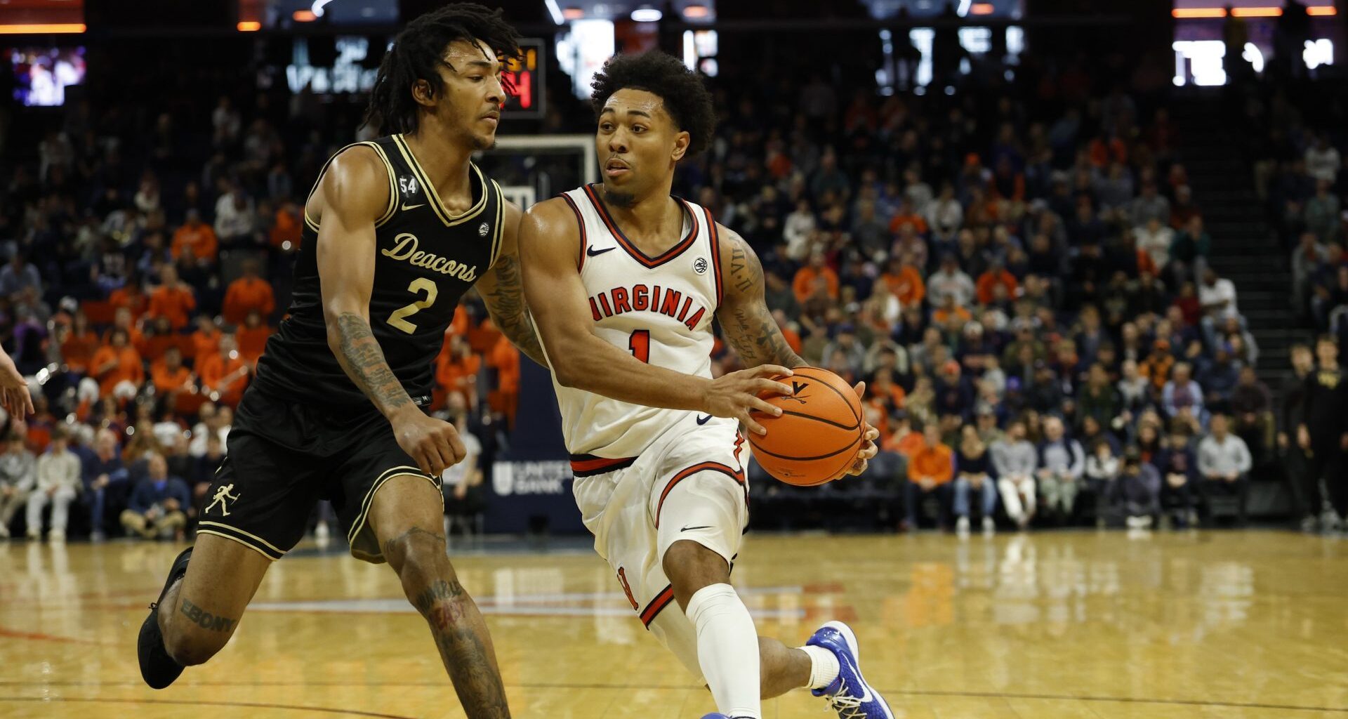 Mar 3, 2026; Charlottesville, Virginia, USA; Virginia Cavaliers guard Malik Thomas (1) drives to the basket as Wake Forest Demon Deacons forward Juke Harris (2) defends in the second half at John Paul Jones Arena.