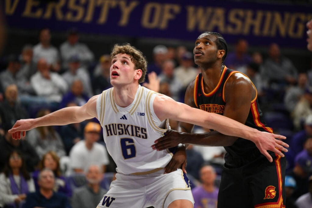 Hannes Steinbach (No. 6) from Washington boxes out USC's Ezra Ausar