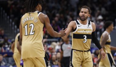 Mar 5, 2026; Washington, District of Columbia, USA; Washington Wizards guard Trae Young (3) celebrates with Wizards guard Tre Johnson (12) after a base against the Utah Jazz in the second half at Capital One Arena. Mandatory Credit: Geoff Burke-Imagn Images