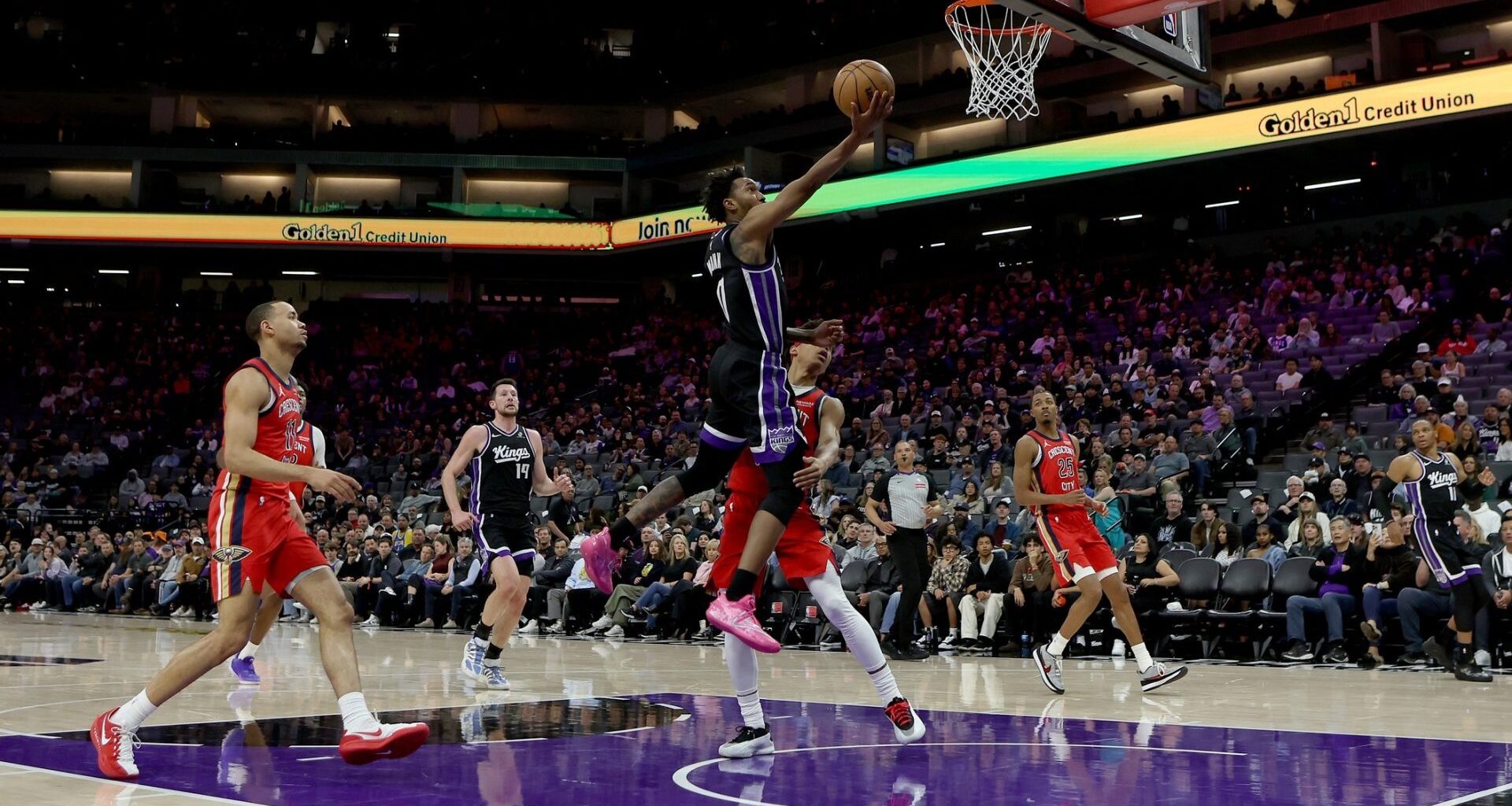 Mar 5, 2026; Sacramento, California, USA; Sacramento Kings guard Malik Monk (0) makes a layup against the New Orleans Pelicans during the fourth quarter at Golden 1 Center.